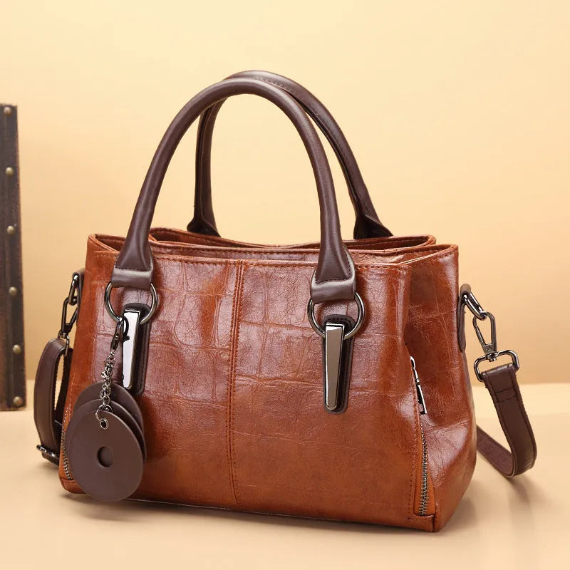 Large capacity shoulder bag with urban simplicity style, showing internal zipper compartments and contrasting sewing thread details