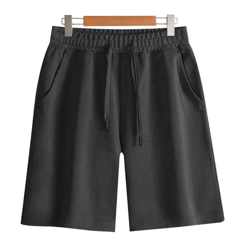 Straight-leg cotton sports shorts in light grey on a mannequin, showing the casual fit.