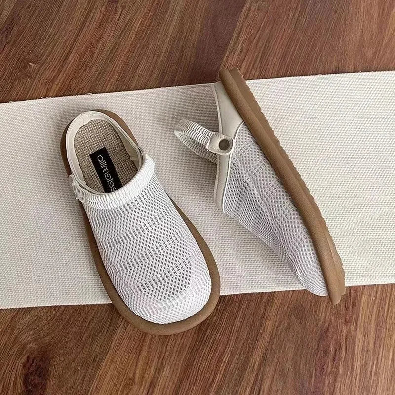 Milky white linen slip-on shoes with mesh lining, round toe, and a light rubber sole on a neutral background.