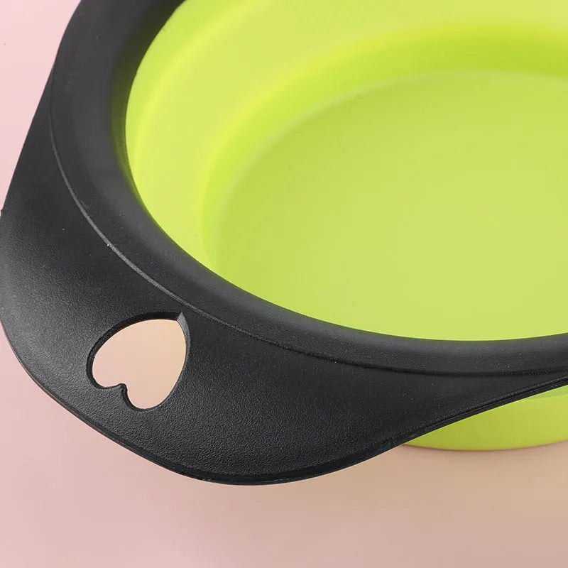 Black and green silicone pet bowls shown folded flat and unfolded ready for use.
