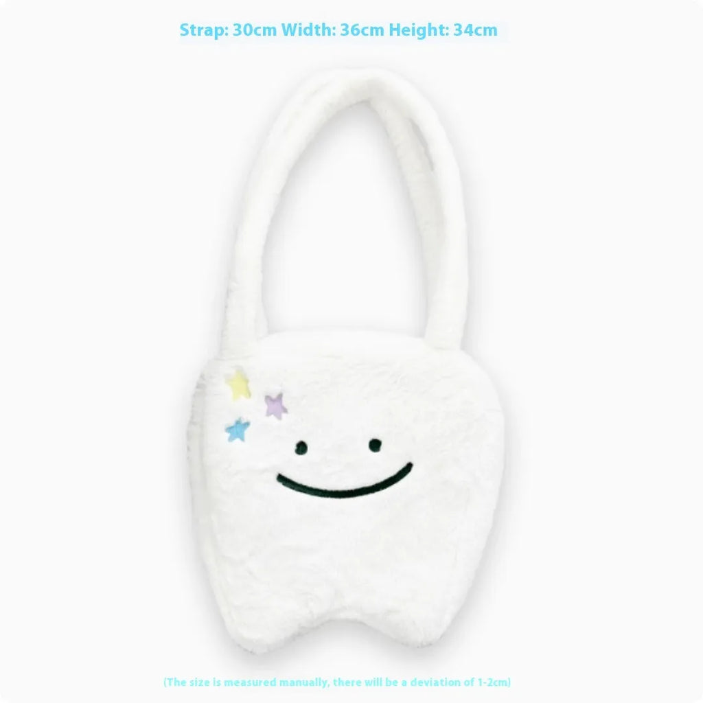 White plush tote bag with cute tooth graphic and a crossbody strap.