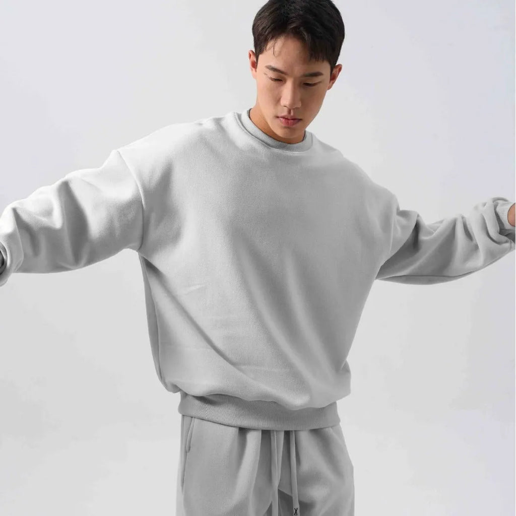 Men's black fleece sports suit with crew neck coat and loose fit trousers for winter wear