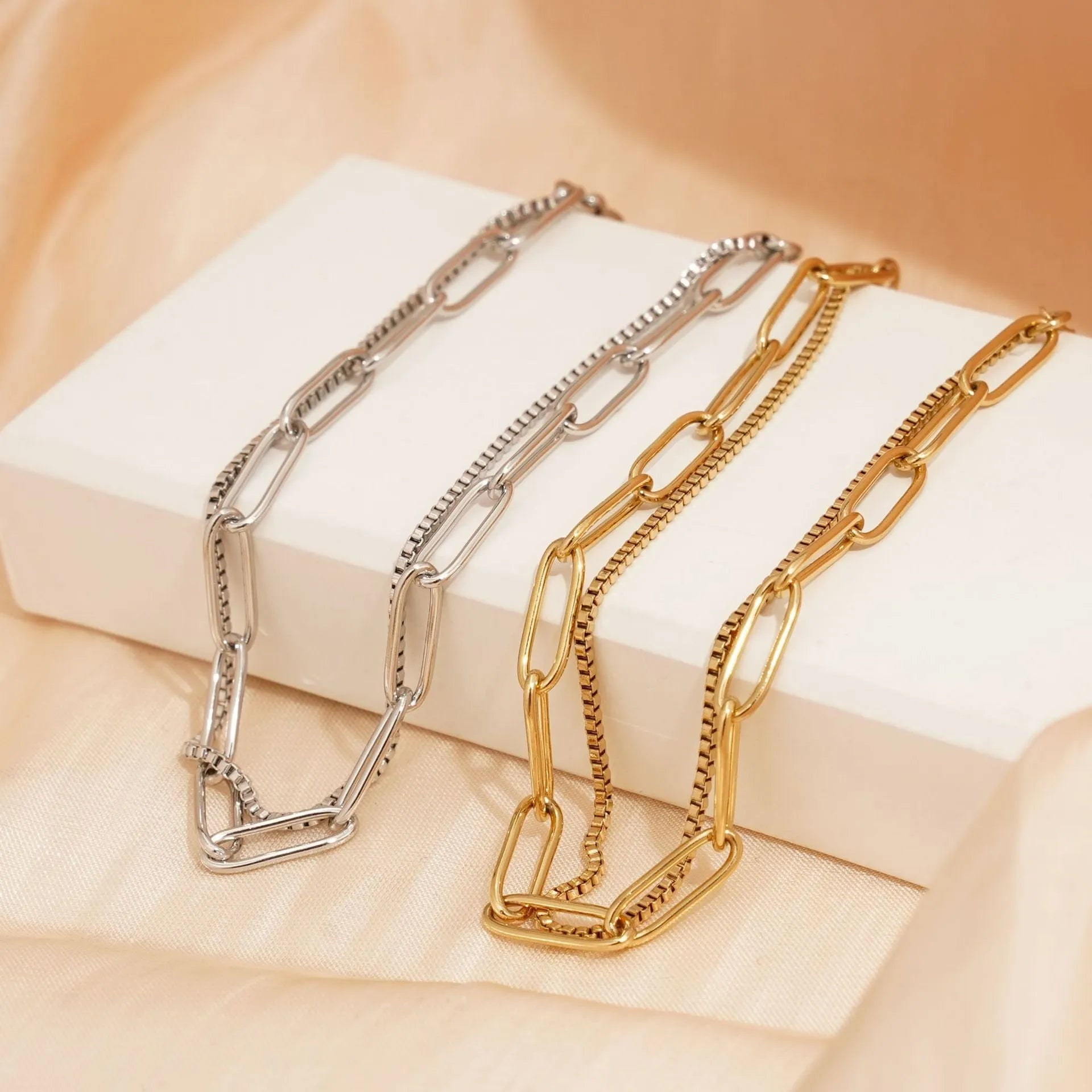 Double layer twin stainless steel bracelet in gold or silver with geometric line design.