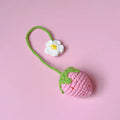 Wool crochet strawberry pendant on a 35cm cord, available in pink or red colours, showcasing handwoven detail