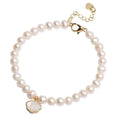 Freshwater pearl bracelet with fan-shaped shell design showing elastic and chain fastening options