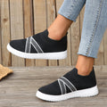 Women's black flyknit mesh casual shoes with flat rubber sole and tassel detail