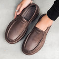 Men's black slip-on work shoes with artificial leather upper and platform mid-heel design