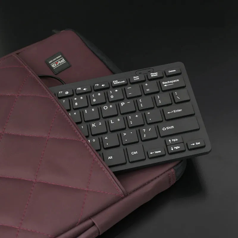 USB wired mini keyboard measuring 280x125mm with 1.3m cable in black, white, pink or blue colour options