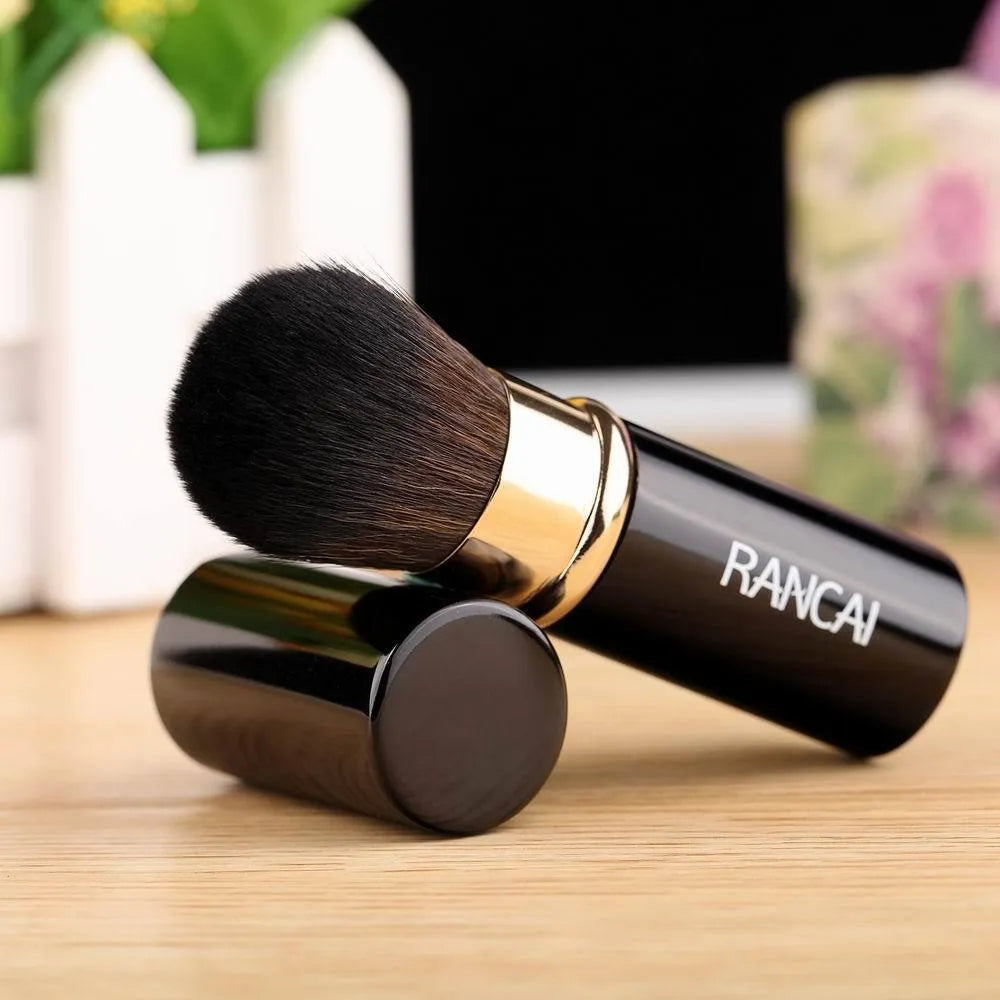 9cm retractable makeup brush with aluminium tube and fibre wool bristles, shown in black and red