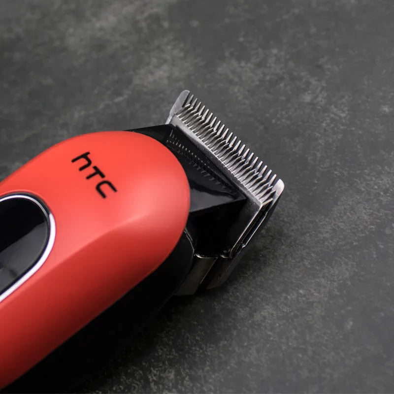 Professional digital electric hair clipper in black, red, or white with charger, comb, oil, brush, and four limiting combs.
