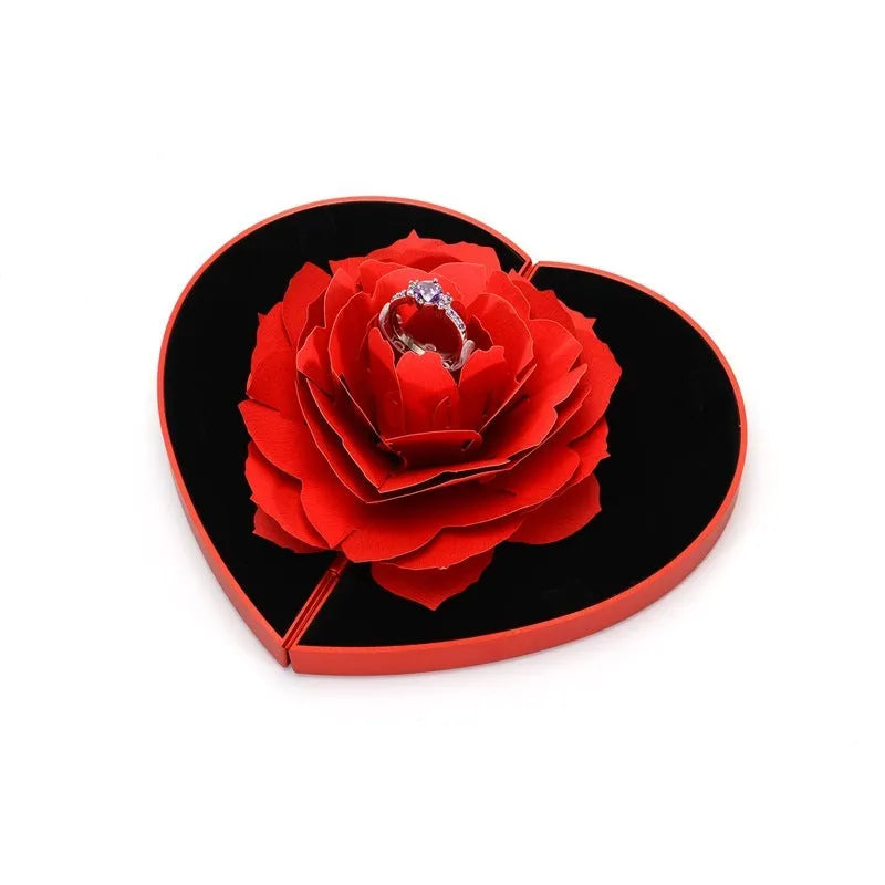 Rotating heart-shaped ring box with 3D rose decoration in red colour