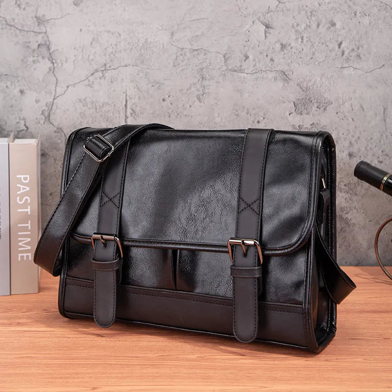 Black Korean-style men's anti-theft backpack made from PU material.