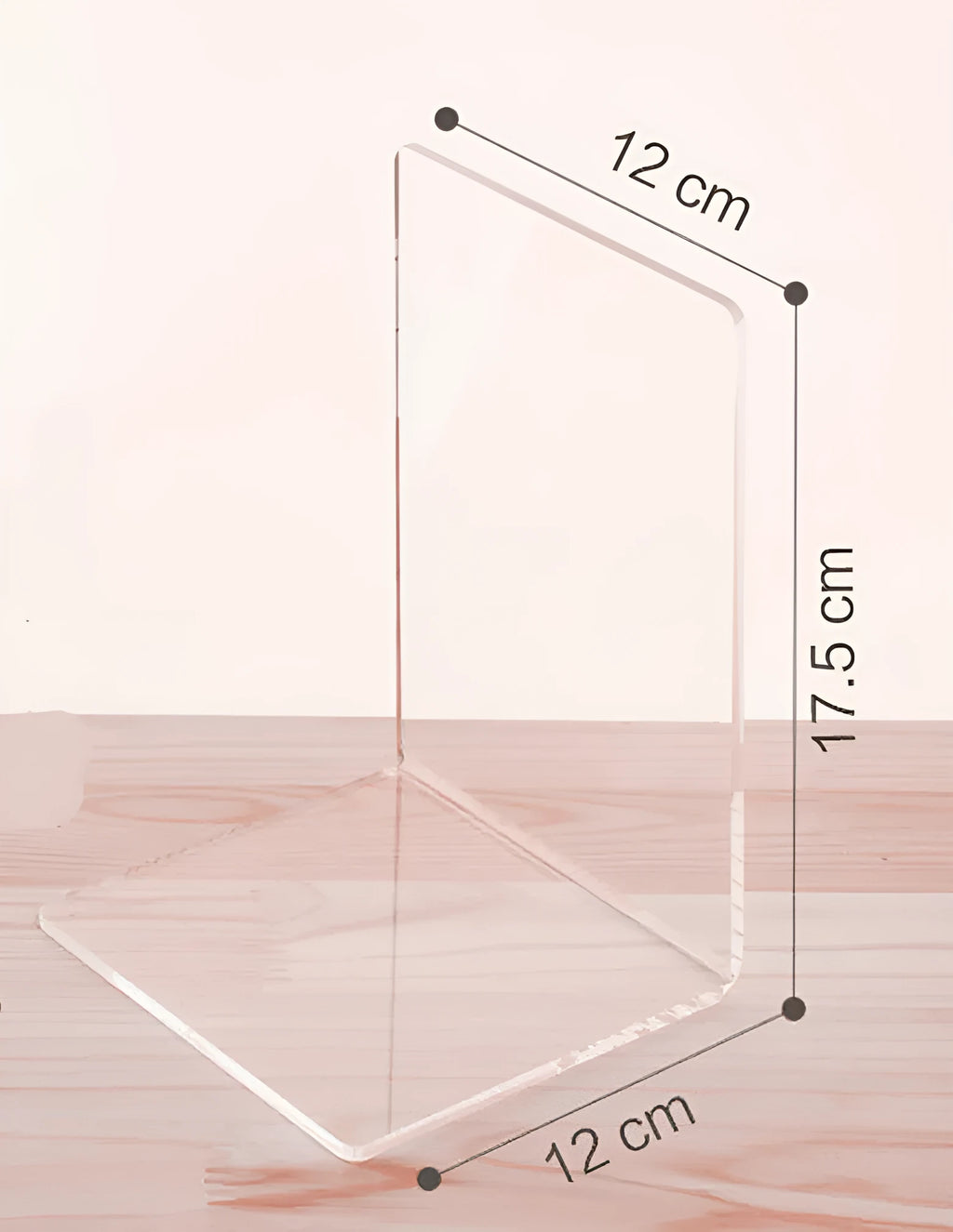 Clear transparent acrylic bookshelf holding a small number of books on a desk