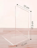 Clear transparent acrylic bookshelf holding a small number of books on a desk