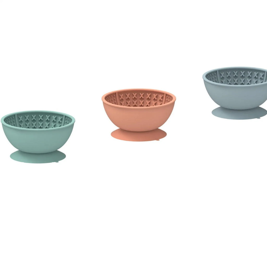 Cyan silicone dog bowl with textured feeding surface and suction cup base, measuring 15.8cm across