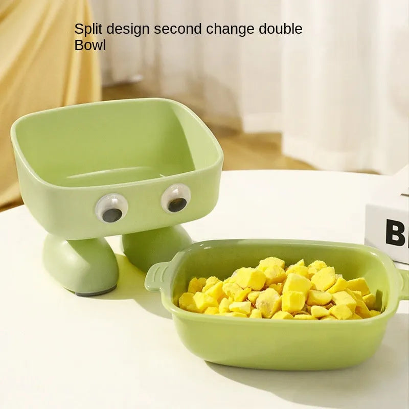 Green robot-shaped elevated cat bowl with tilted design and detachable inner food container