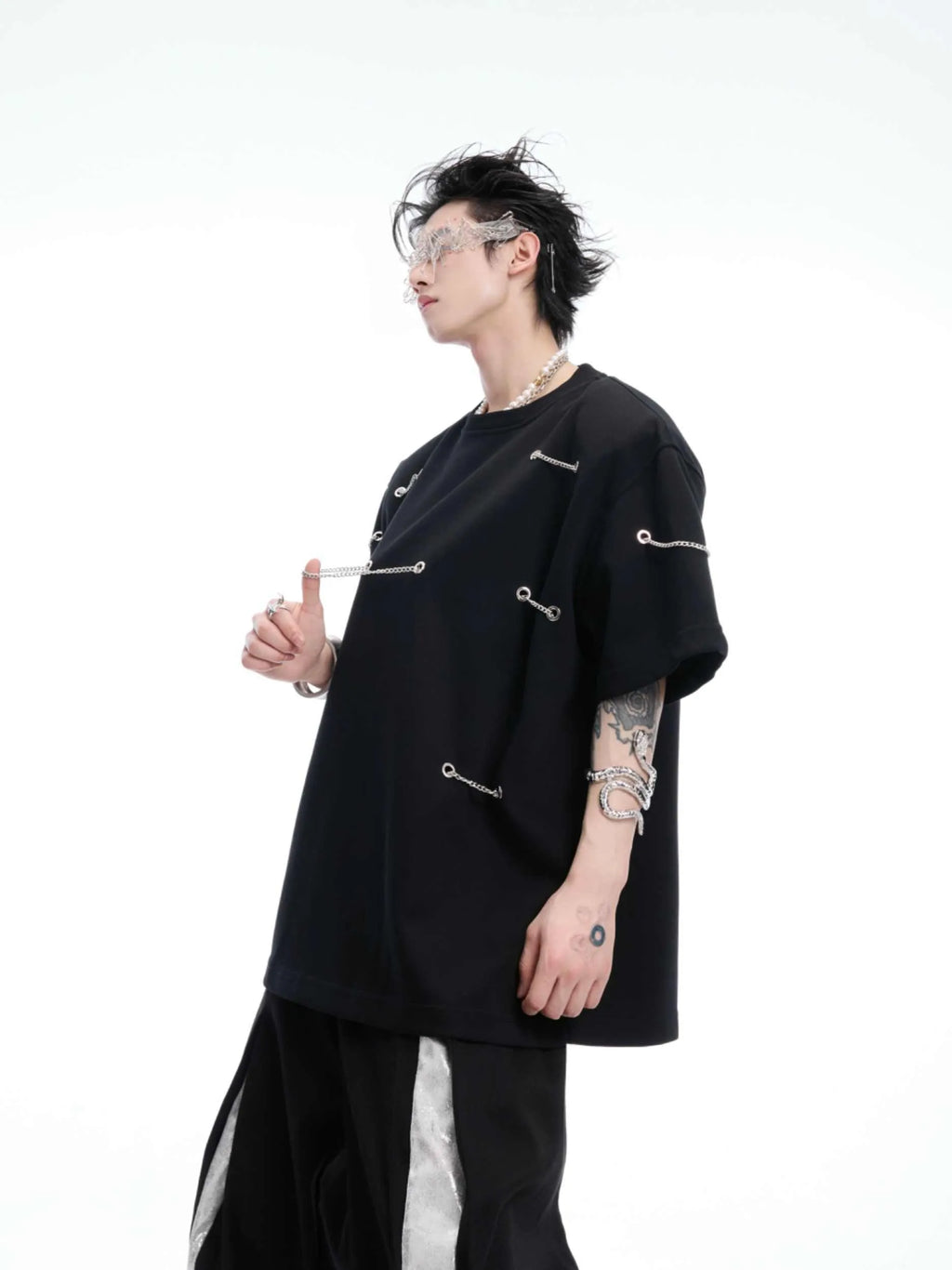 Black men's T-shirt with metal chain detail on padded shoulders, short sleeves, and round neck.