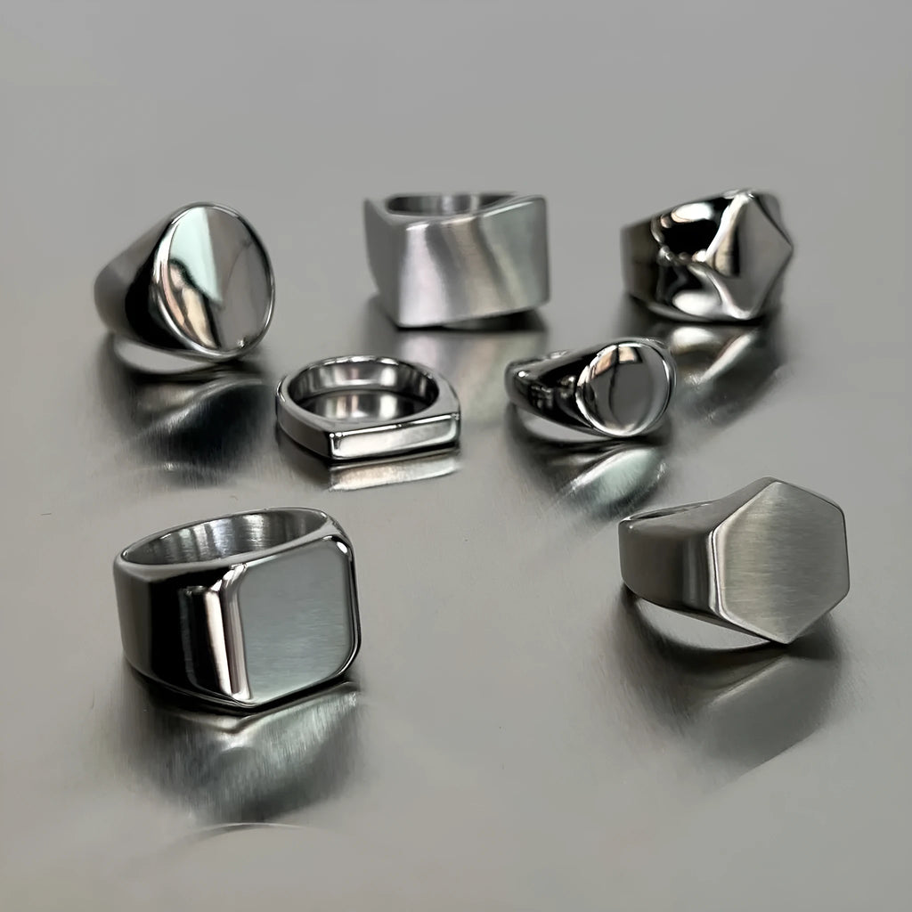 Smooth plain titanium steel ring in sizes 7 to 11, shown in square, oval, round and curved style options.