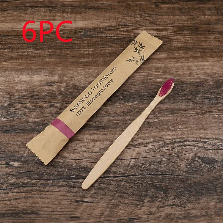 Set of 10 bamboo toothbrushes with charcoal bristles in various colours showing 17.5cm handles