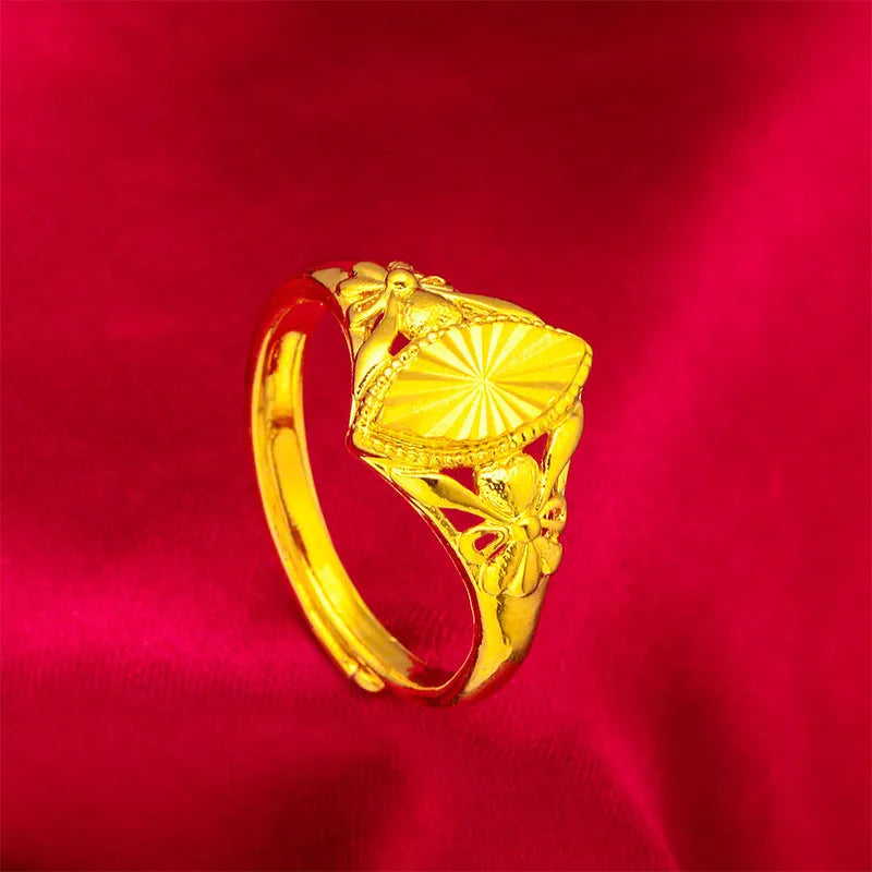 Gold geometric flower ring with textured surface and open adjustable band design