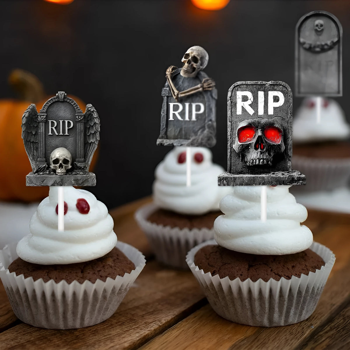 Pack of twelve small paper Halloween cake flags with tombstone designs in horror styles for spooky decoration