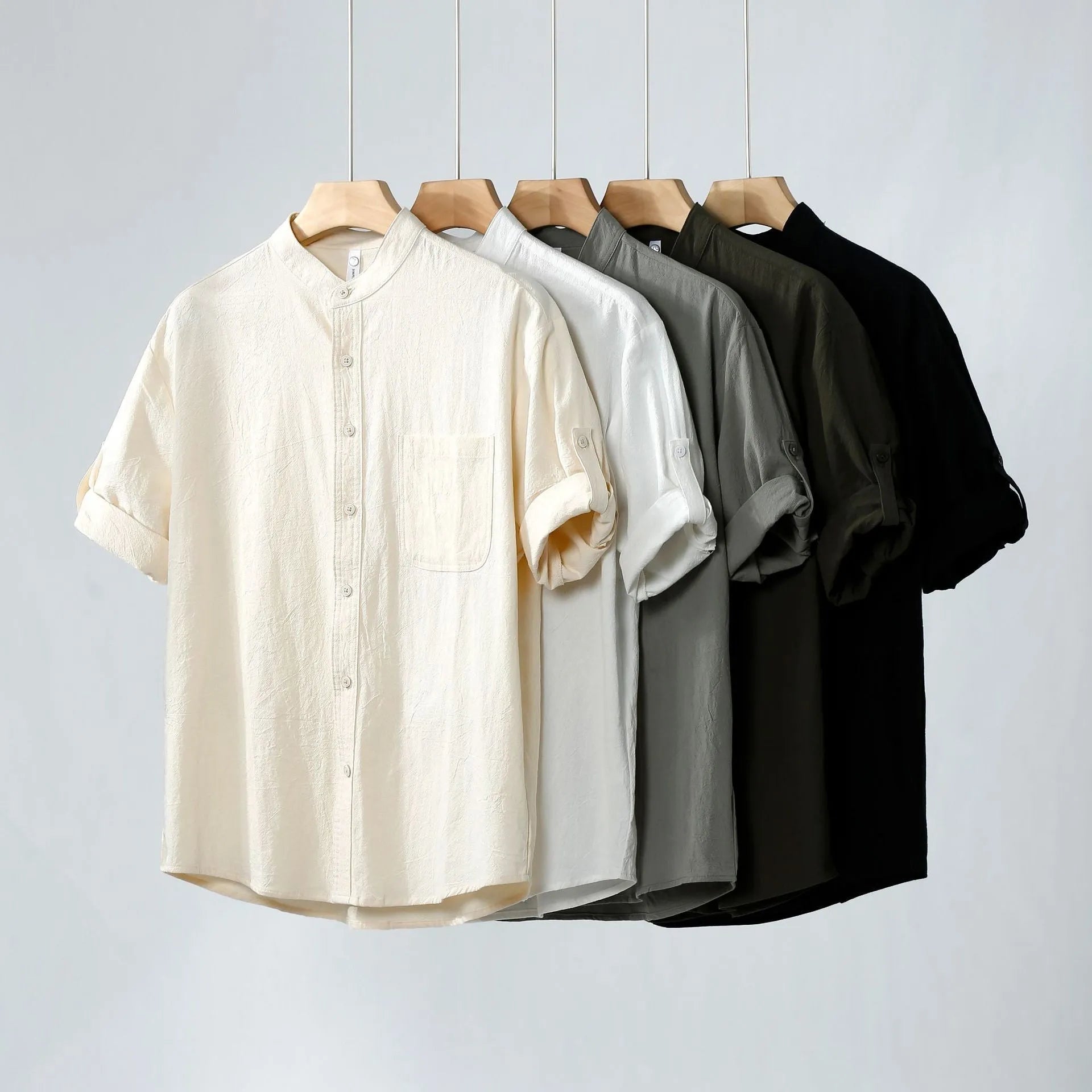 Men's loose fit linen short-sleeve shirt in a solid colour with a simple stand collar.