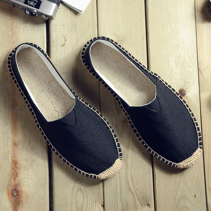 Men's solid-colour canvas casual shoes with round toe in various colours on a plain background.