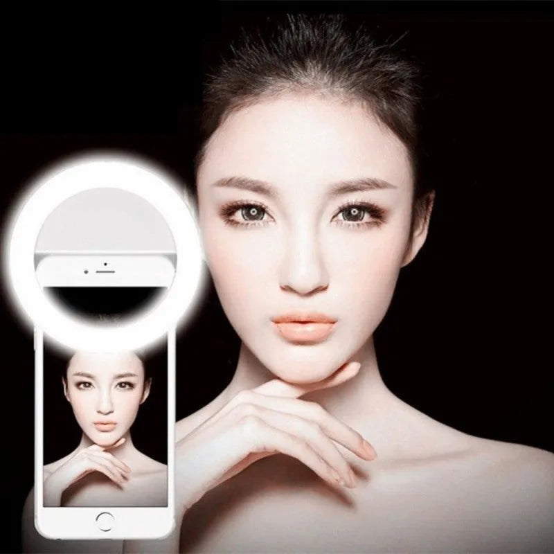 Selfie ring light with clip attached to mobile phone, showing LED bulbs and anti-slip sponge in green, white, black, or pink