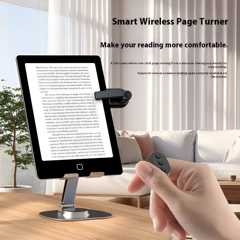 Black wireless page turner remote control and a small clicker on a wooden table.