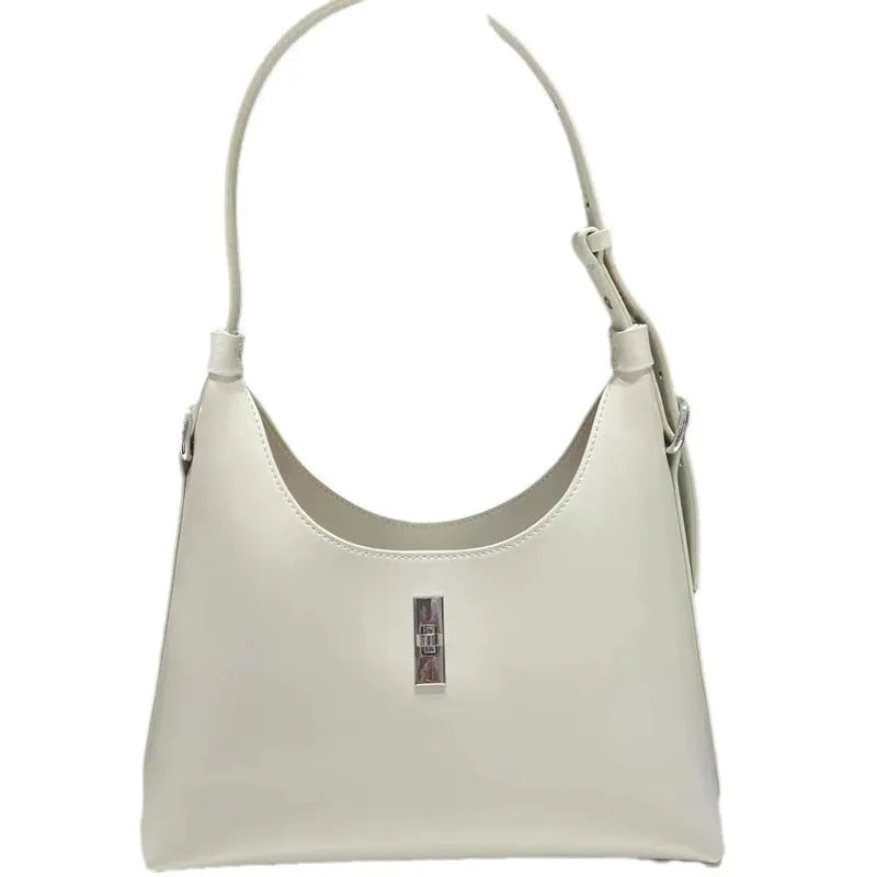 Genuine leather crossbody shoulder bag with dumpling shape, internal organisation pockets, and street trend style details