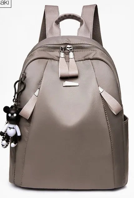 Women's Oxford cloth backpack in black, large capacity anti-theft travel bag with zipper closure and soft handle