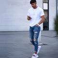 Men's deep blue cotton jeans showing the five-pocket design on a neutral background.