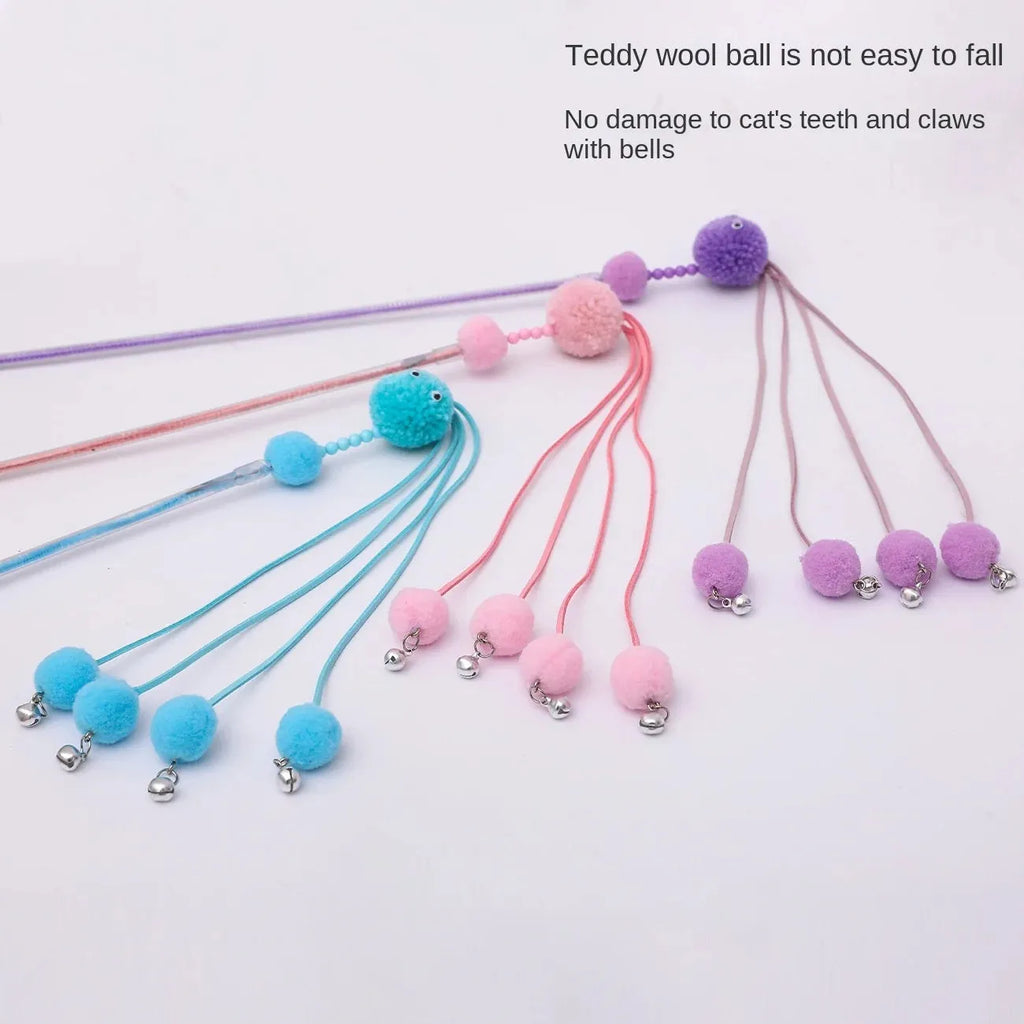 Blue funny cat stick toy with colourful fabric tassels on a plastic wand for interactive play with cats.