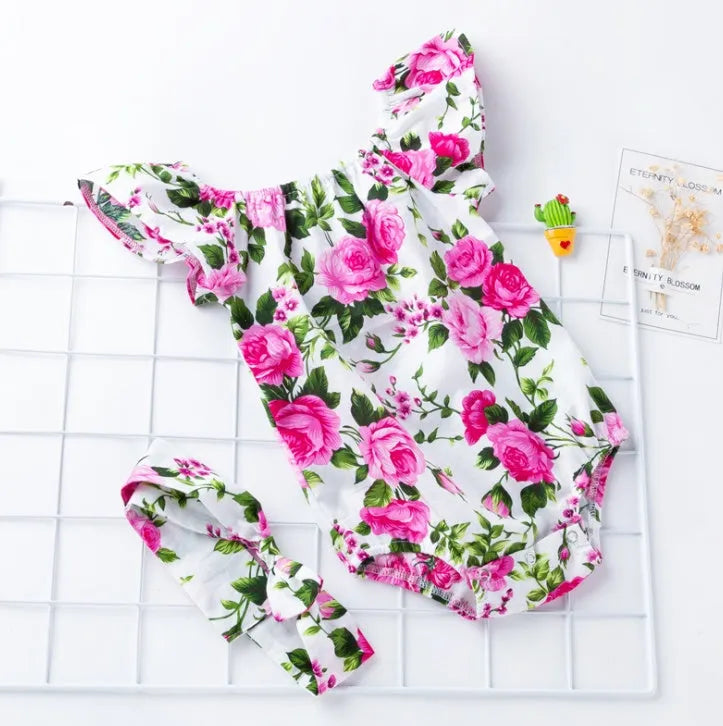 Cotton baby romper for infant girls with triangle climbing style and sleeveless design in black or white colour