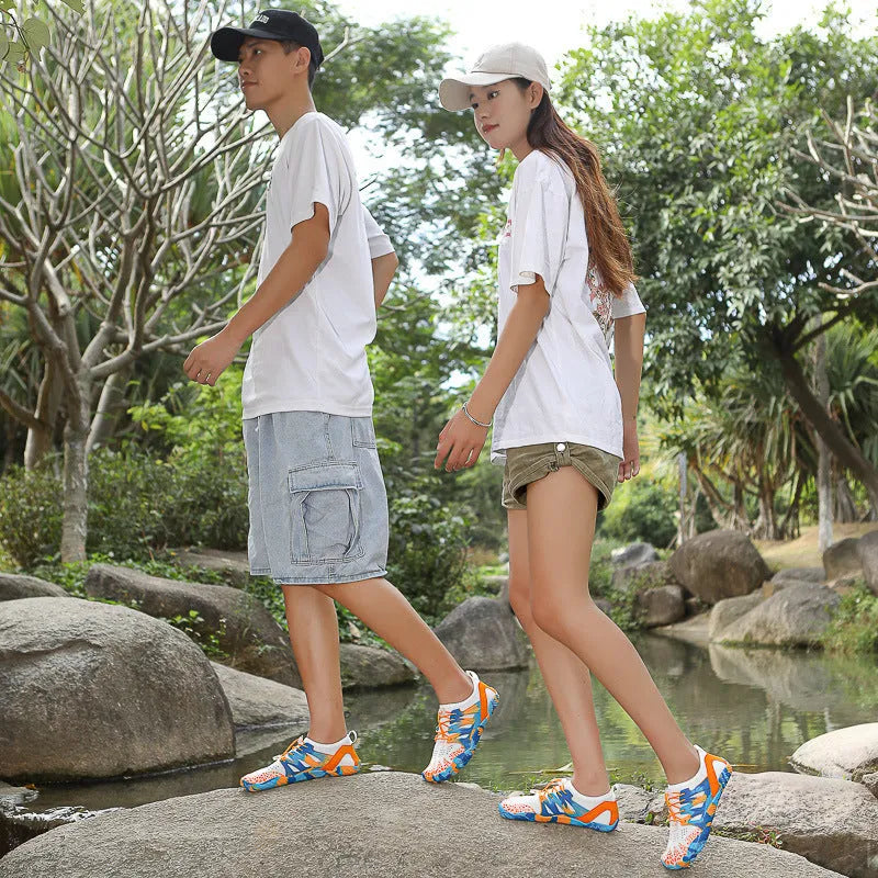 Men's and women's quick-drying lace-up beach shoes in blue with mesh upper and textured rubber sole.