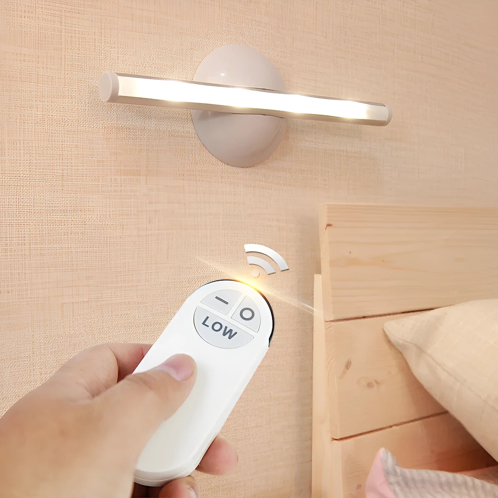 White LED portable night light with a remote control on a wooden surface.