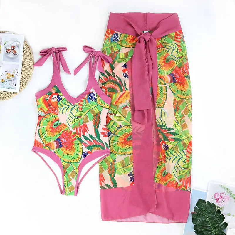 Pink floral print one-piece swimsuit with V-neck and attached skirt for women
