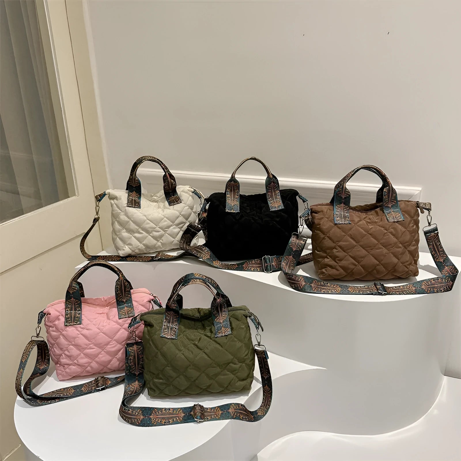 A soft oxford cloth shoulder messenger bag in a horizontal square shape with a single strap.