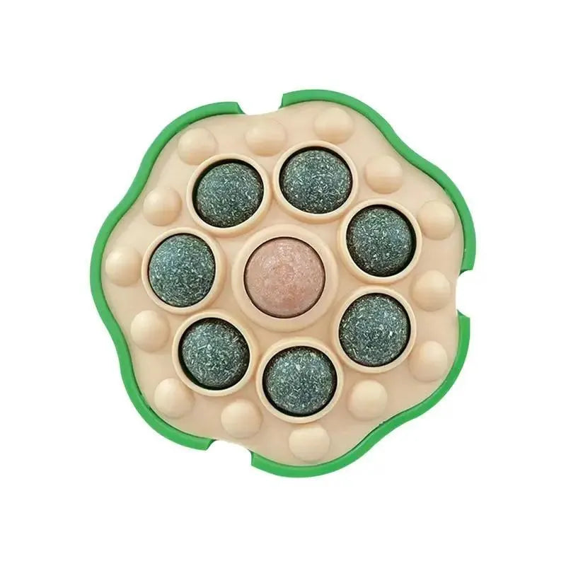 Green lotus-shaped catnip ball with adhesive backing for wall mounting