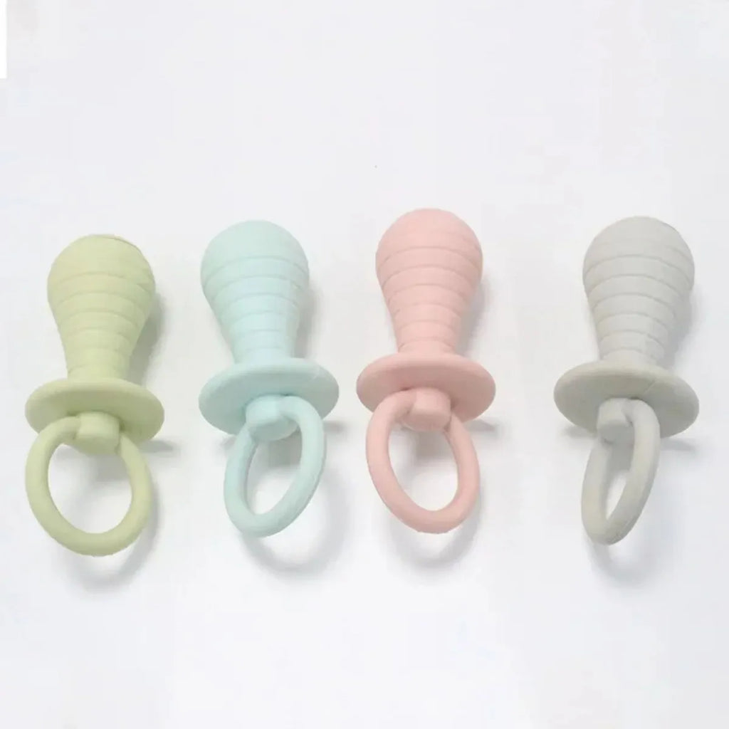 A green TPR rubber pet pacifier chew toy with a squeaker for puppies and kittens.