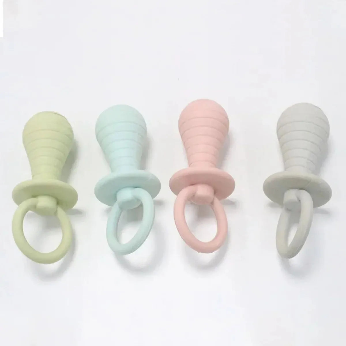 A green TPR rubber pet pacifier chew toy with a squeaker for puppies and kittens.