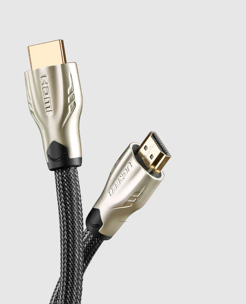 Version 2.0 4K HDMI cable with gold-plated connectors and black PVC jacket showing triple-layer shielding construction