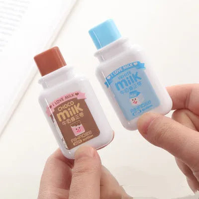 Creative bottle-shaped correction tape with decorative patterns showing curved comfortable design