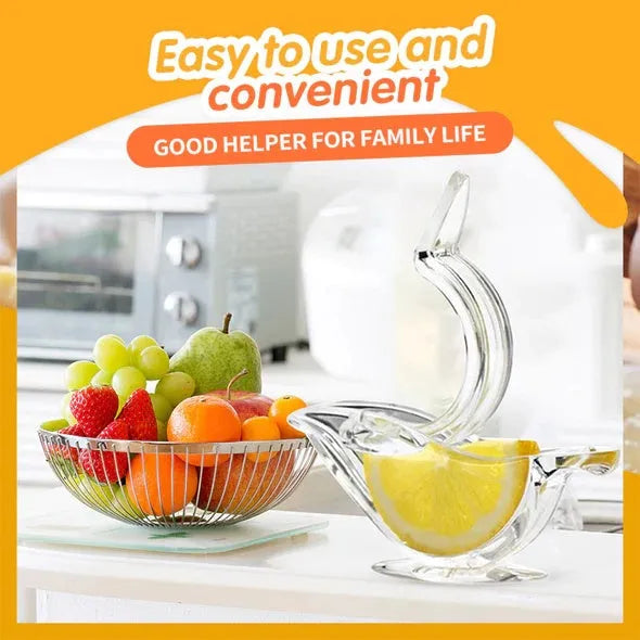 Transparent acrylic bird-shaped manual lemon juicer on a kitchen counter