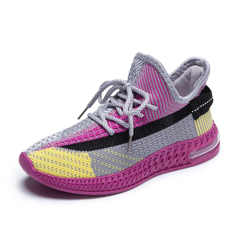 Women's low-top running shoes in purple, featuring a rounded toe and front lace-up design.