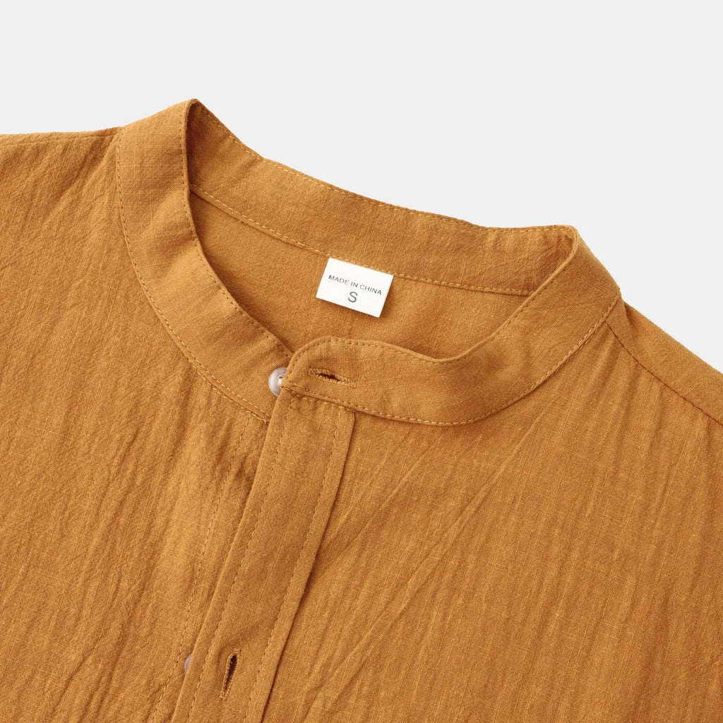 Men's slim fit brown long sleeve shirt and casual pants on a hanger