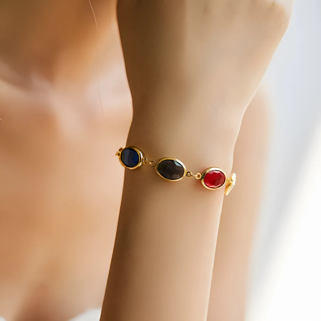 Geometric copper bracelet with blue inlaid glass elliptical design for women.