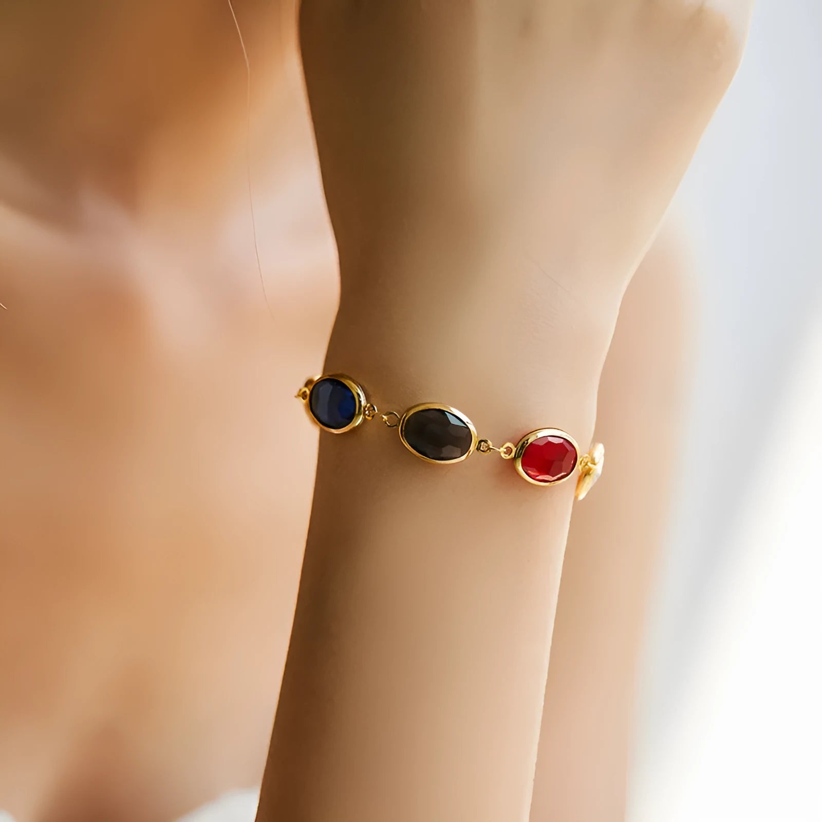 Geometric copper bracelet with blue inlaid glass elliptical design for women.