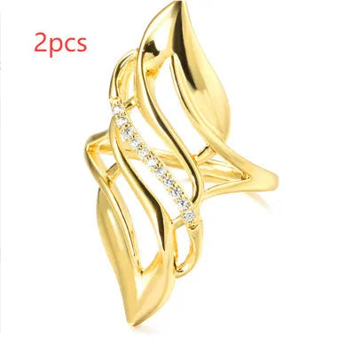 Women's exaggerated curve ring in Q611 gold colour on copper with casual styling