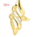 Women's exaggerated curve ring in Q611 gold colour on copper with casual styling